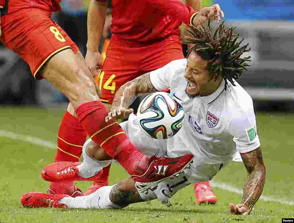 Belgium's Marouane Fellaini kicks the ball near Jermaine Jones of the U.S. during the 2014 World Cup round of 16 game at Fonte Nova arena in Salvador, Brazil, July 1, 2014. Belgium won the match 2-1.