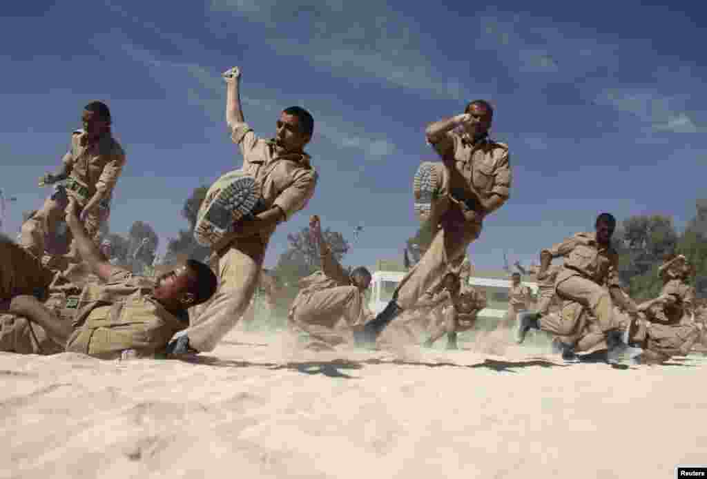 Newly recruited members of the Yemeni military police force participate in exercises at their barracks in Sana'a.