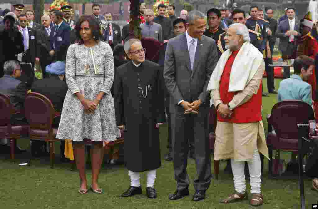 U.S. President Barack Obama, second right and first lady Michelle Obama, left stand with Indian Prime Minister Narendra Modi, right and Indian President Pranab Mukherjee during a photo op at a reception hosted by Mukherjee on India’s Republic Day at the presidential palace in New Delhi, India.