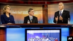 Sen. Kay Hagan, D-N.C., left, and Libertarian Party Senate candidate Sean Haugh, center, listen as North Carolina Republican Senate candidate Thom Tillis speaks during a debate on Oct. 9, 2014. (AP Photo/Gerry Broome, Pool)