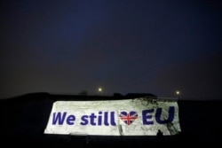 A projection appears on a wall in Ramsgate, southern England, Jan. 31, 2020.
