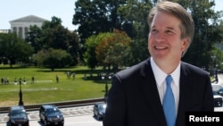 With the U.S. Supreme Court building in the background, Supreme Court nominee judge Brett Kavanaugh arrives prior to meeting with Senate Majority Leader Mitch McConnell on Capitol Hill in Washington, July 10, 2018. 