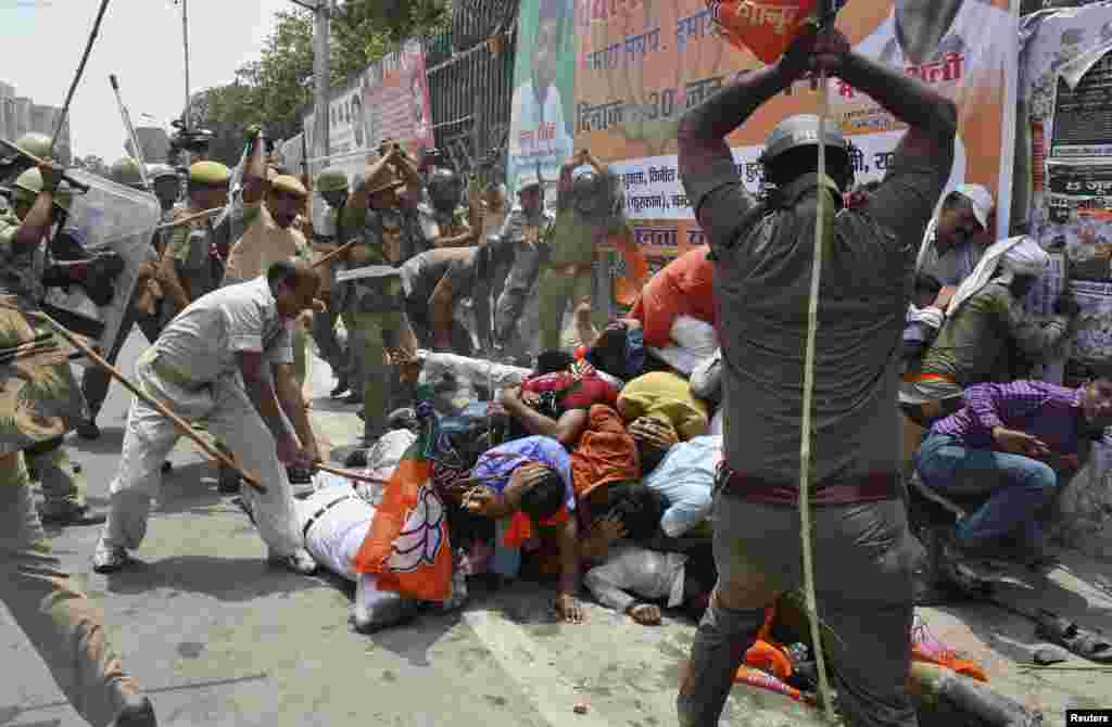 Indian policemen use batons to disperse youth-wing workers of country's ruling Bharatiya Janata Party (BJP) during a protest outside the state assembly in the northern city of Lucknow. Hundreds of workers protested against the state government over what they say is deteriorating law-and-order situation in the Uttar Pradesh state, local media reported.