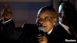 South Africa's President Jacob Zuma celebrates with his supporters after he survived a no-confidence motion in parliament in Cape Town, South Africa, August 8, 2017. 